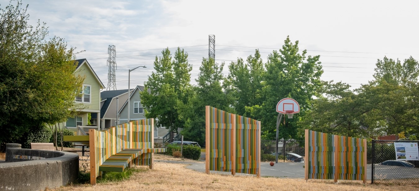 Multi-colored seating structure outside of the basketball court.